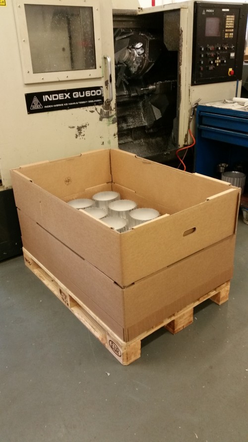 Quick-frame packaging next to a CNC machine